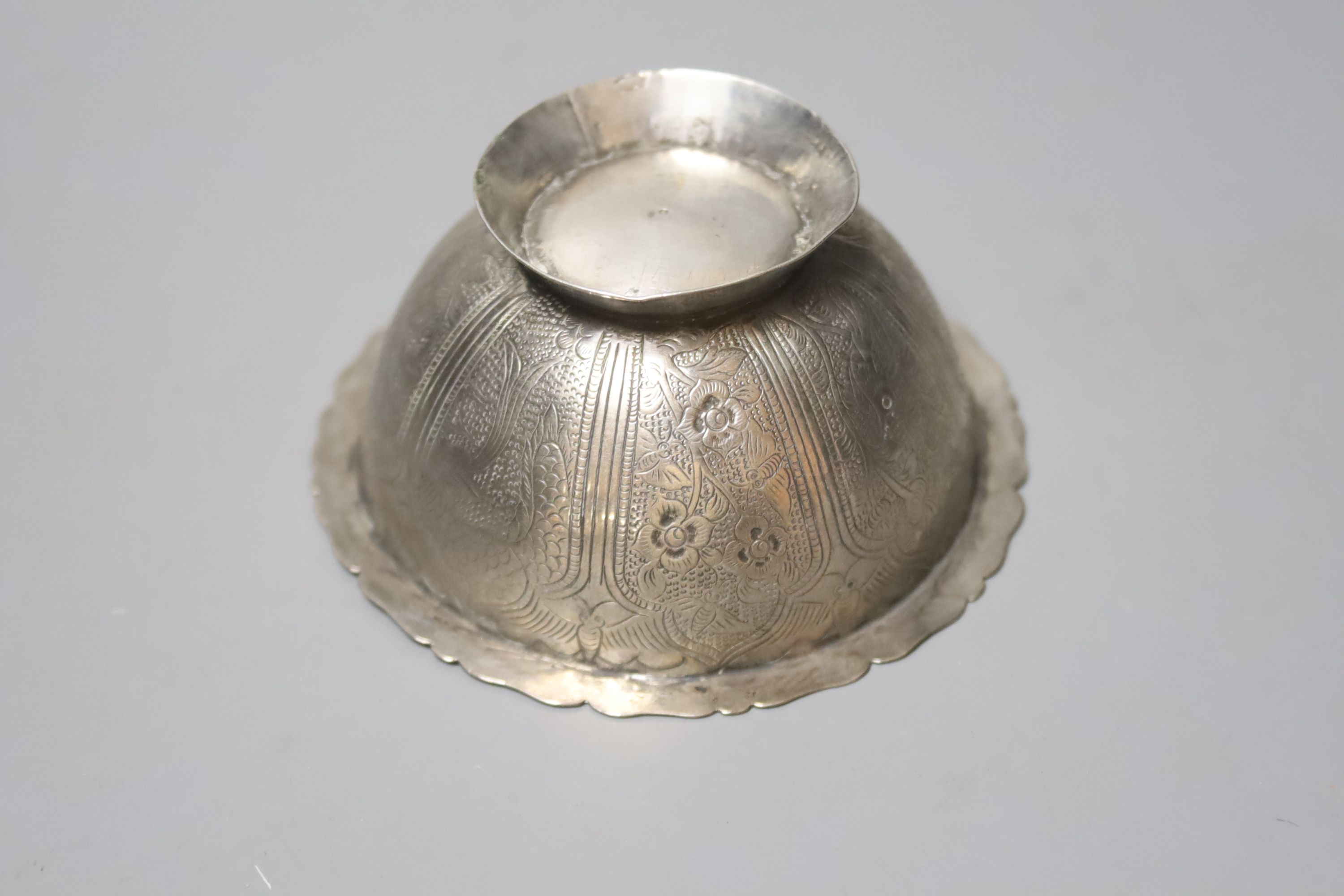 A Chinese small metal bowl, decorated with a floral design, Tang dynasty style, 9cm diameter 4cm high